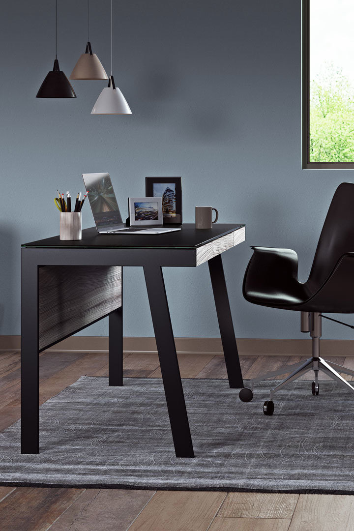 The Sigma 6903 compact laptop desk includes a modesty panel that complements seated use, allows the 6903 to float in a room, and helps to keep wiring neatly concealed.